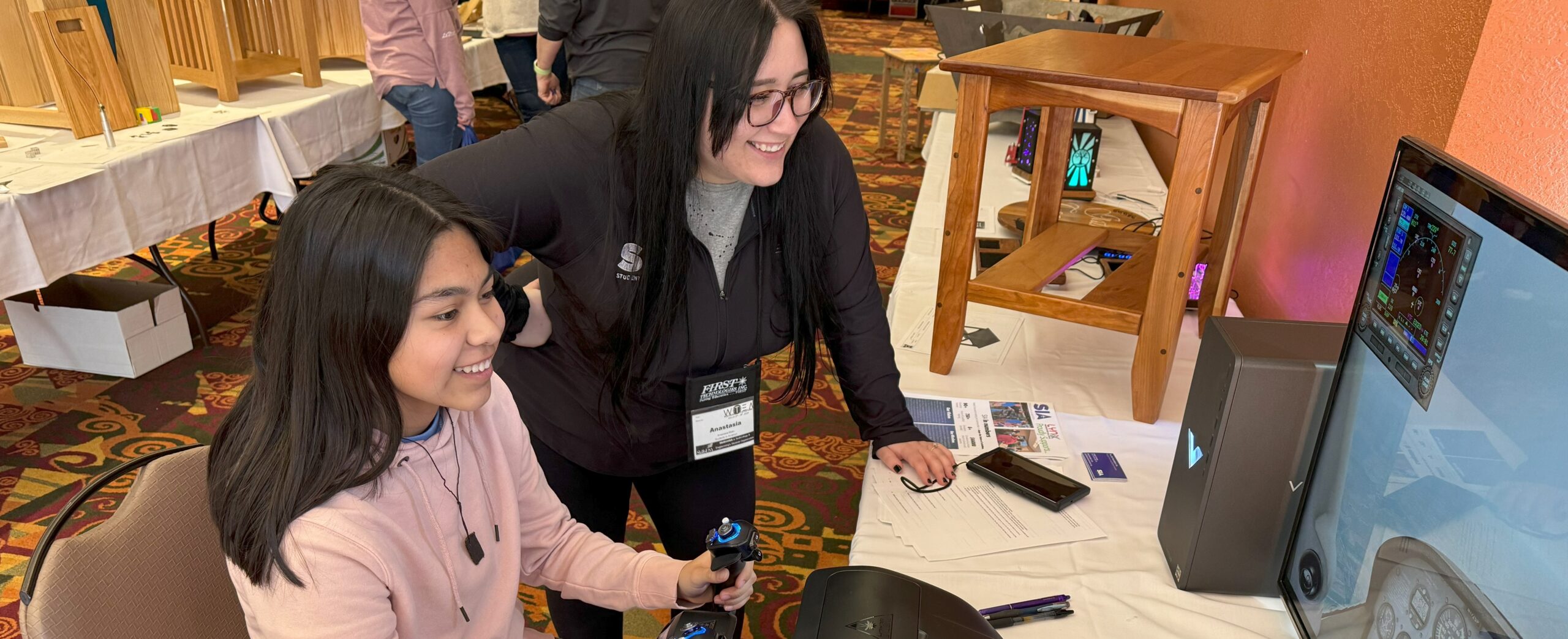 Anna instructs Jocelyn, a current SIA student at WTEA