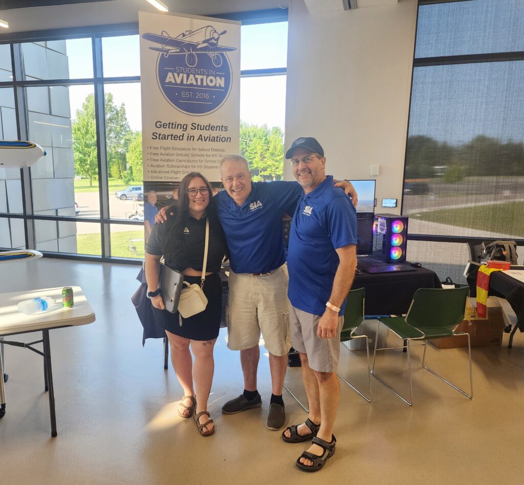 Anastasia Eisen, Joe Canepa and his brother John Canepa help out at the Teacher Day event.