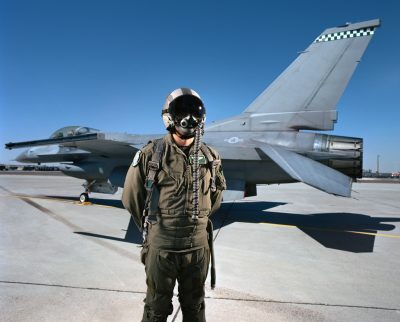 fighter pilot in front of jet